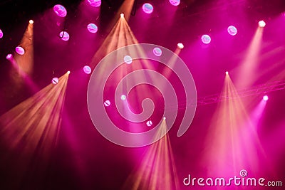 Lighting equipment on the stage of the theatre during the performance. The light rays from the spotlight through the smoke Stock Photo