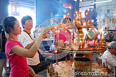 Lighting Joss Sticks Editorial Stock Photo