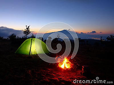 Lighting Tent, Campfire And Volcano Etna At Dawn, Sicily Stock Photo