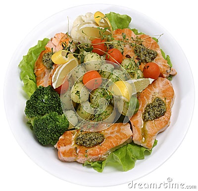 Salmon served with vegetables and greens Stock Photo