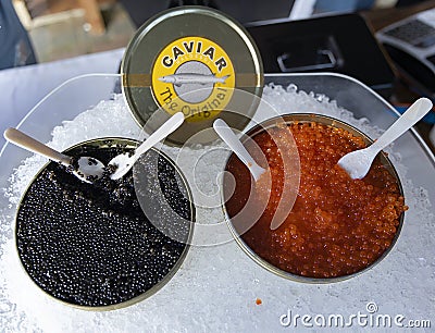 Lightly salted black and red caviar on ice. Stock Photo