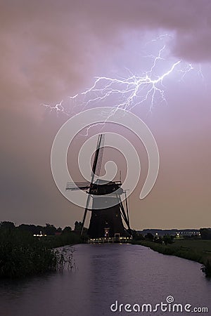 Lightning bolt over a classic windmill Stock Photo