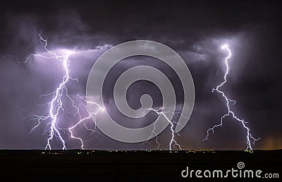 Lightning Bolts Strike the Ground from a Cloud Stock Photo
