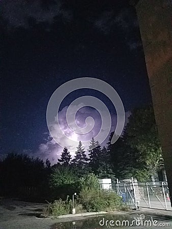 Lightning clouds night trees storm Stock Photo