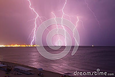 Lightning over the sea before the storm Stock Photo