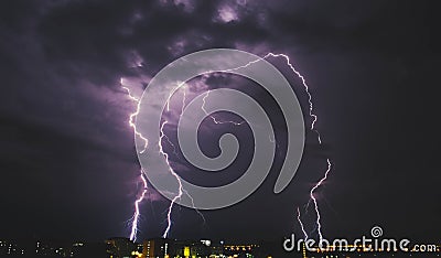 Lightning storm over countryside city at night in Thailand Stock Photo