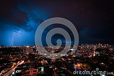 Lightning Storm Over Ribeirao Preto City in Brazil. Thunder blue light on a summer night concept image Stock Photo