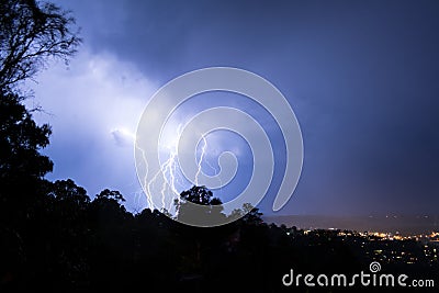 Lightning striking the ground with intensity Stock Photo