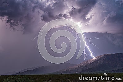 Lightning striking a mountain Stock Photo