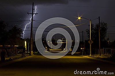 Lightning Striking in a Neighborhood of Tucson Arizona at Night Time Stock Photo