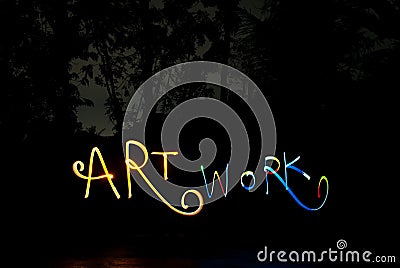 Lightpainting writing the word art work in darkness Stock Photo