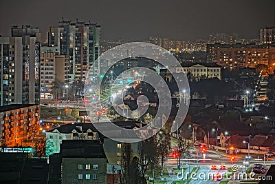 The lights of the night city. View of the busy city traffic and the light from the headlights of cars at night. The lights are on Editorial Stock Photo