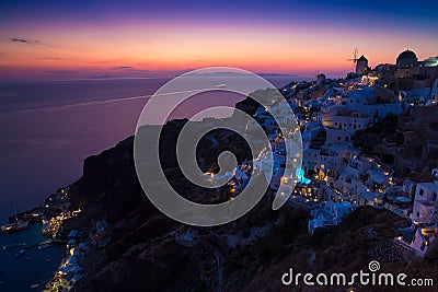 Lights of Oia village at night, Santorini, Greece. Stock Photo