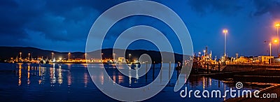 Lights, ships and boats in a Castletownbere harbor at night Stock Photo