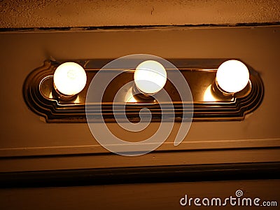 Lights on a wall in a hallway Stock Photo