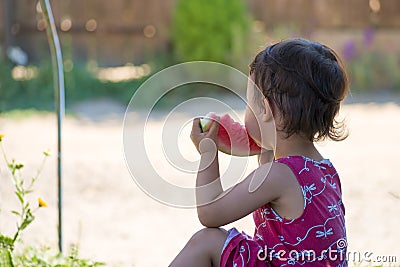 Liitle girl eating watermelon in summer Stock Photo