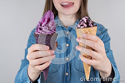 Like love lover ice cream concept. Cropped close up photo of positive cheerful excited girl in jeans denim shirt holding two yummy Stock Photo
