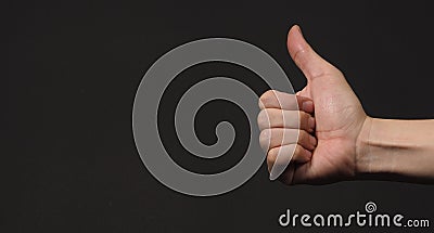 Like sign or thumbs up human hand sign isolated on black background.copy space Stock Photo
