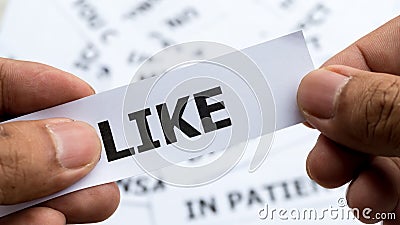 Like text or word meaning on paper in hand holding Stock Photo