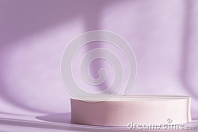 Lilac backdrop with pink round podium, display, mockup. Cosmetic product presentation with shadows and light from Stock Photo