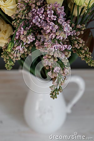 Lilac in a bouquet of flowers in a jug Stock Photo