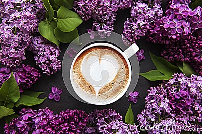 Lilac and cup of coffee in flat style on black concrete background Stock Photo