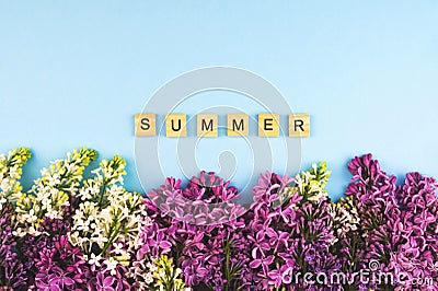 Lilac flower blooming background. Summer wooden lettres text, concept clipart. Closeup floral frame Stock Photo
