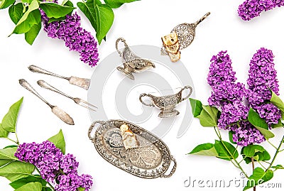 Lilac flowers. Coffee tea cake silber dishes. Flat lay Stock Photo