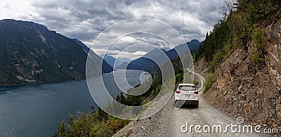 Mazda SUV driving on a Dirt Road in the Mountain Valley Editorial Stock Photo