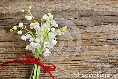 Lilly of the valley flowers on wooden background. Stock Photo