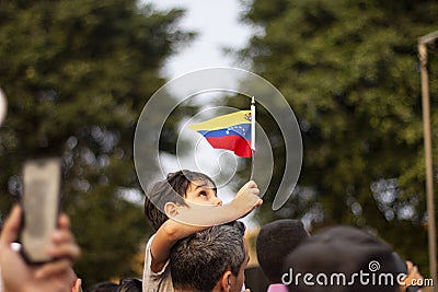 Lima, Lima / Peru - February 2 2019: Kid holding Venezuelan flag in protest against Nicolas Maduro Editorial Stock Photo