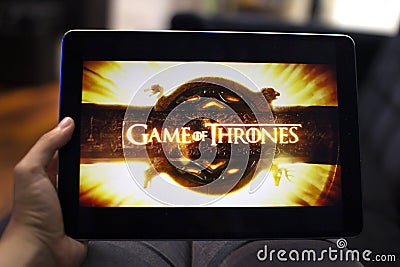 Watching Game of Thrones in a tablet Editorial Stock Photo