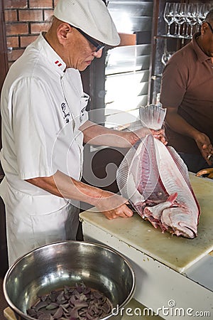 Peruvian Chef Javier Wong, prepares fresh ceviche and seafood dishes at his restaurant Chez Wong. Lima, Peru Editorial Stock Photo