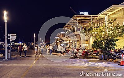 Night view to Molos promenade with people walking Editorial Stock Photo