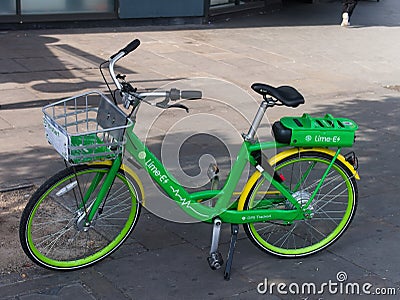 Lime Electric bike parked on a street Editorial Stock Photo