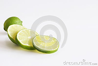 Lime. Fresh fruit isolated on white background. Slice, piece, half, quarter. Rich of nutrients, fibre, and vitamins. Picture Stock Photo