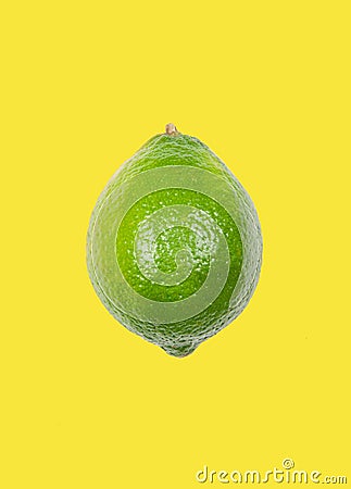 Lime levitate in air on yellow background. Concept of fruit levitation Stock Photo