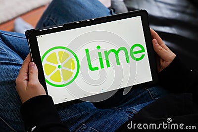 LIME screen tablet application hand logo of app rent bike e-Scooter rental electric scooter cycle company Editorial Stock Photo