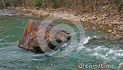 Iron Oxide Boulder In Stream Stock Photo