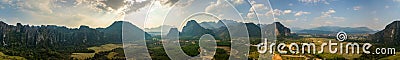 Beautiful City of Vang Vieng aerial Panorama Limestone Mountains at Sunset Stock Photo