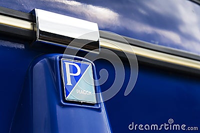 Limited edition model of three-wheeled vehicle Piaggio Ape Calessino stands on street on 1 August 2016 in Livigno, Italy. Editorial Stock Photo