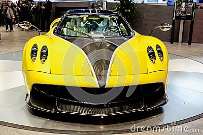 Limited yellow edition Pagani Huayra Italian race car on international car show Editorial Stock Photo