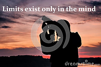 Limits exist only in the mind. Motivational and inspirational quote. Beautiful sunset with man and camera. Stock Photo