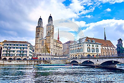 Limmat river and Munsterbrucke bridge with Grossmunster, houses on the river's bank, Zurich, Switzerland Stock Photo