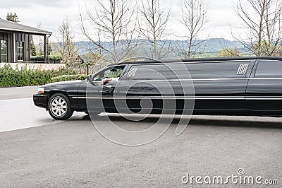 Driver waits in his limousine Stock Photo