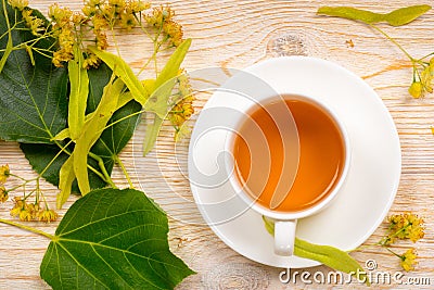 Linden herbal tea on wooden table Stock Photo