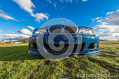 Wideangle view of the front of a blue BMW M3 E46.. Editorial Stock Photo