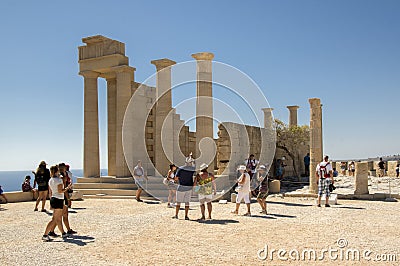 Lindos Acropolis fortified citadel, Rhodes island / GREECE - September 7, 2017: Amazing ruins with groups of curious travelers Editorial Stock Photo