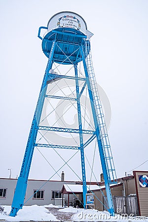 Famous teapot shaped watertower reads Welcome to Lindstrom translated from Swedish Editorial Stock Photo