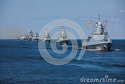 A line ahead of modern russian military naval battleships warships in the row, northern fleet and baltic sea fleet, summer sunny Editorial Stock Photo